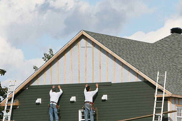 Professional Siding Replacement technician working in Freedom, PA